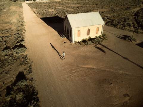 Man walking down the main street of Silverton, New South Wales