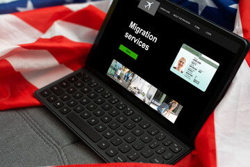 A laptop next to the USA flag. Flag of the United States close up. Concept - US government sites....