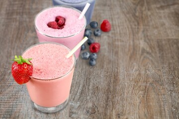 Set of tasty fresh various milkshakes with berries