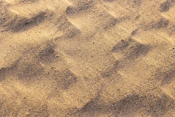 Textura de arena en la playa al amanecer - obrazy, fototapety, plakaty
