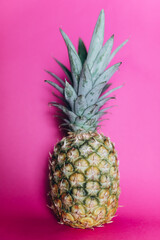A pineapple on a pink backgrpund, food photography 