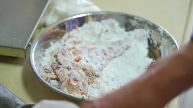 A chef is making deep-fried cutled  Pork and fried cutled Chicken