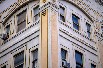 Obraz premium Yellow Facade on a Vintage White Walled Building.