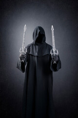 Dark knight with hooded cape and two swords over dark misty background