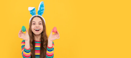 happy easter teen girl in bunny ears holding painted eggs for holiday egg hunt. Easter child horizontal poster. Web banner header of bunny kid, copy space.