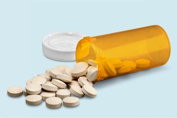 White medical tablets pills in bottle