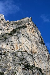 evocative image of sea coast with promontory on the background in Sicily, Italy
