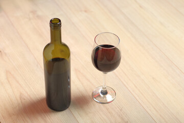 a bottle of wine with a glass