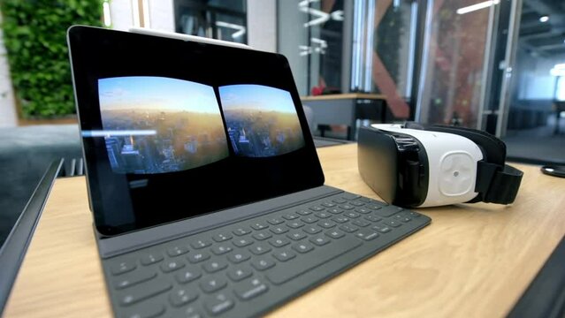 Tablet on a table showing image visible in the VR glasses located nearby