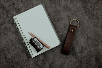 Open a notebook with blank space and pencil and roll film. The concept of nostalgia and memory