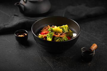 Bowl of asian cooked rice with beef and vegetables