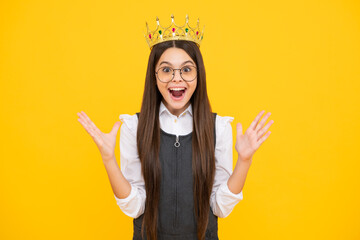 Teenager princess child celebrates success win and victory. Teen girl in queen crown. Excited face, cheerful emotions of teenager girl. © Olena