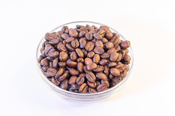 Coffee beans in glass bowl isolated on white background with clipping path