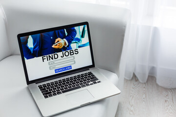 online using job search computer app, jobless seeker looking for new vacancies on website page at laptop screen, recruitment concept