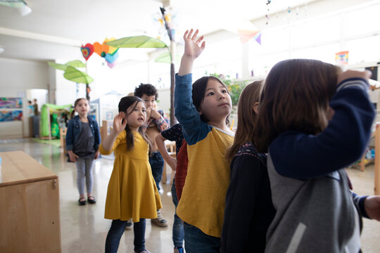 Preschool students lining up in classroom