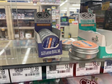 Grocery store CBD products display tin cans