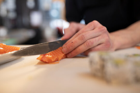 Close up of man preparing sushi