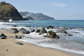 beach landscape at couple rock Meotoiwa for lover with white column on beach in Fukuoka Japan 