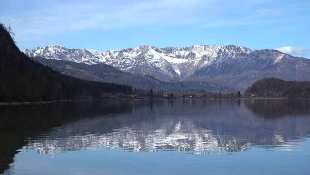 Bad Goisern, Austria - March 2023: Beautiful city view. Mountain Lake. Lake among the mountains. Huts in the mountains near the forest lake