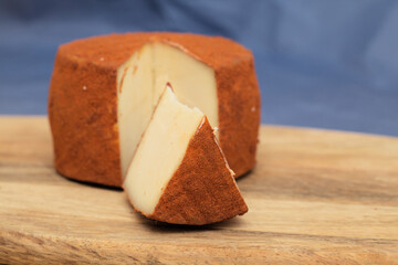 Produce of Gran Canaria - speciality goat semi cured milk cheese with paprika covering