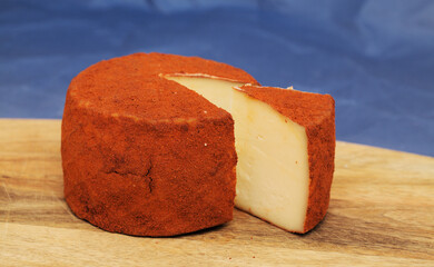 Produce of Gran Canaria - speciality goat semi cured milk cheese with paprika covering