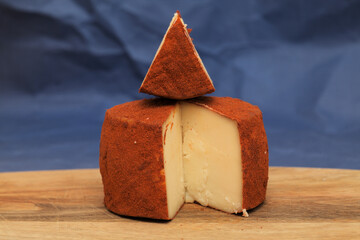 Produce of Gran Canaria - speciality goat semi cured milk cheese with paprika covering
