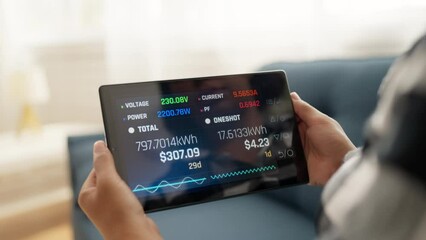 Smart electric meter calculating energy consumption costs, mobile app interface