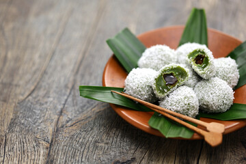 Onde-onde is a traditional Malaysian dessert consisting of green(made from pandan leaves juice)...