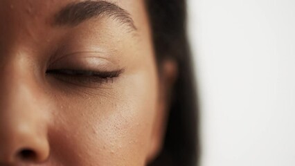 Closeup of African American woman's eye, DNA research, genetics, ancestry - Powered by Adobe