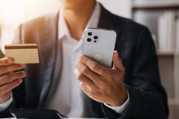 Close up of woman hand using credit card and laptop for payment and online shopping, Online shopping, payments digital banking, E-commerce concept.