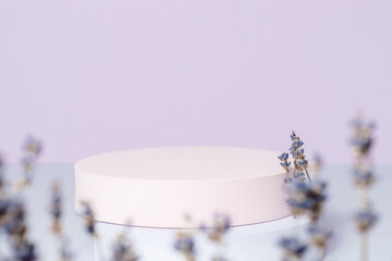 Empty showcase with lavender flowers on violet background. Podium for product, gift, cosmetic and...