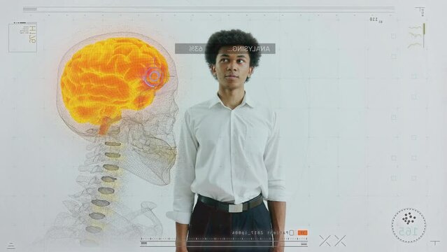 Young man monitoring brain function using holographic projection, high-end tech