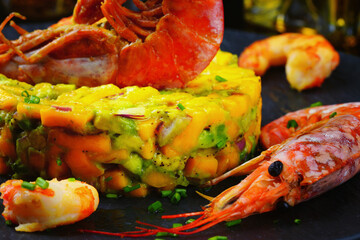King prawn, avocado, mango, lettuce, dark background, home food, restaurant.