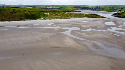 Inchydoney Beach in the south of Ireland on a cloudy summer day, top view. Seaside landscape. The famous Irish beach. The coastline.