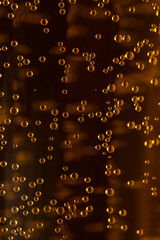 a lot of small bubbles in a glass of liquid. Macro
