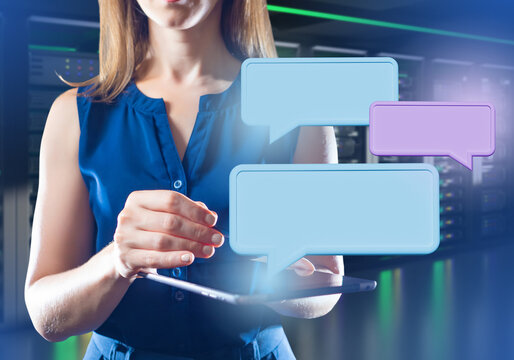 Businesswoman with tablet. Woman in data center. Speech bubbles near gadget. Businesswoman in server room. Concept of business in it industry. Cropped businesswoman with tablet computer - Powered by Adobe