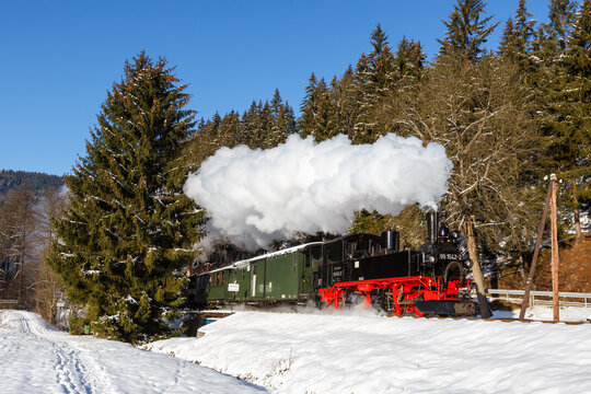 Pressnitztalbahn steam train locomotive railway in winter in Schmalzgrube, Germany