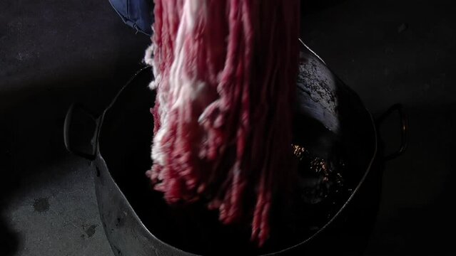 Dye from Natural Organic Ingredients, Woman Using Natural Beets for Dyeing Fabric on a Dye Pot in Her House. Close Up.  