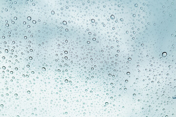 Naklejka na ściany i meble Raindrops on window glasses surface