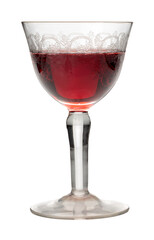 Glass of cherry, vintage glass decorated with red cherry liqueur