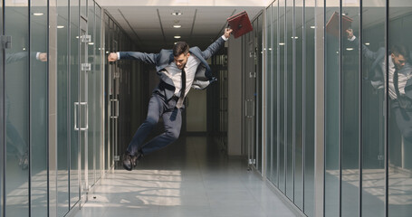 Happy businessman jumping after him work successful at office building. Funny Caucasian manager...