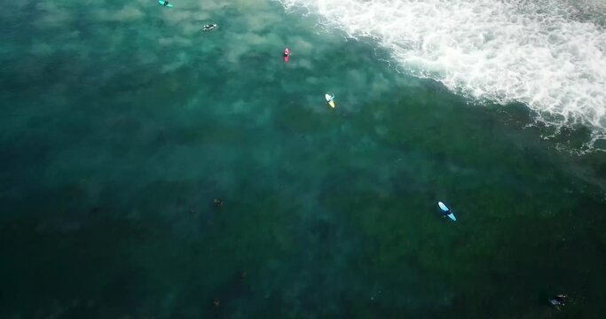 Aerial footage above surfers in Laguna Beach