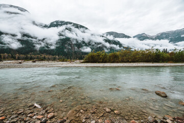 River in Alaska where grizzlies like to fish with foggy mountains