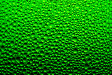 water drop background on green glass bottle,Texture water drops on the bottle