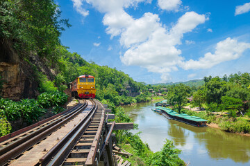 Death Railway, Thailand,World war II historic railway, known as the Death Railway with a lot of tourists on the train taking photos of beautiful views over Kwai Noi River.