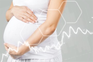 Happy pregnant woman with chart of hormone level