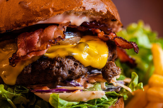 Homemade cheeseburger with cheese and vegetables