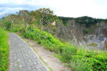 Pedestrian path at the top of crater wall of Mount Mahawu, Tomohon, North Sulawesi.