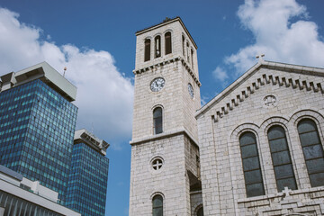 Fototapeta na wymiar Belltower of the Saint Joseph's Church in Sarajevo, Bosnia and Herzegovina