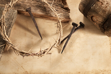 Crucifixion Of Jesus Christ. Cross With three Nails And Crown Of Thorns on ground